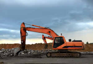 Red Orange excavator on construction site