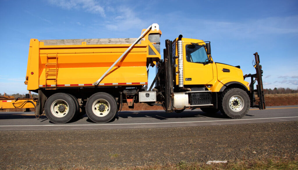 Yellow Iron Yellow Dumptruck on Road