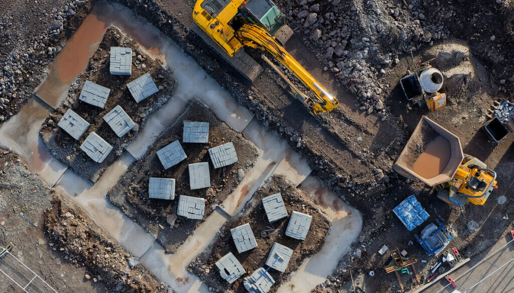 Excavator working on foundation site