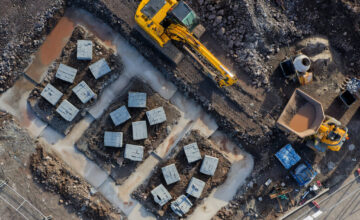 Excavator working on foundation site