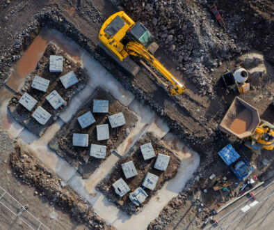 Excavator working on foundation site
