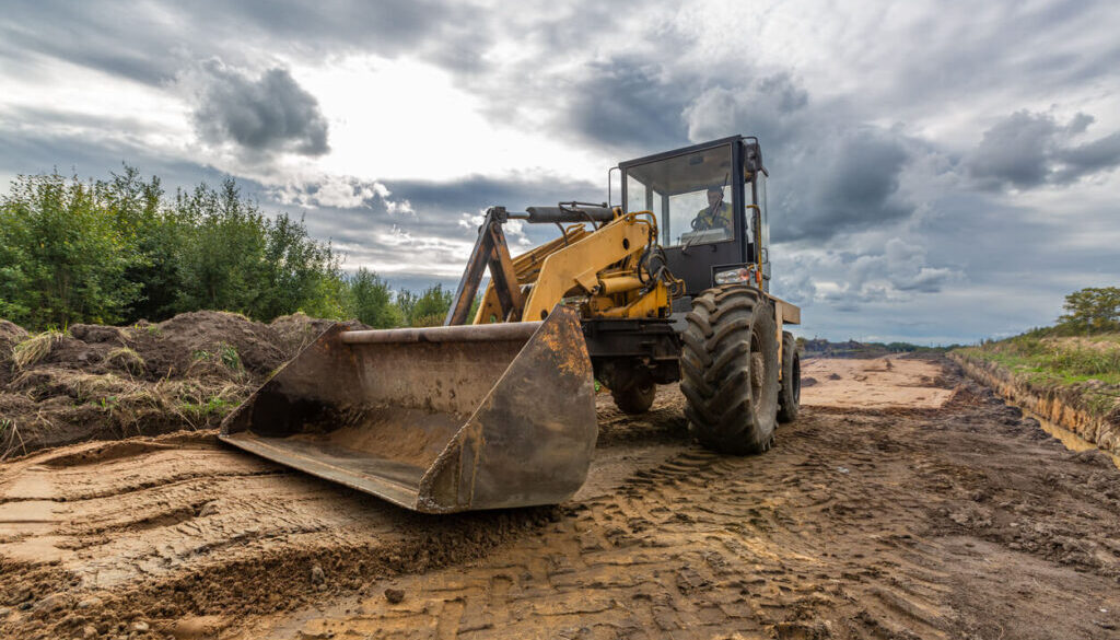 Skid steer working on a construction site