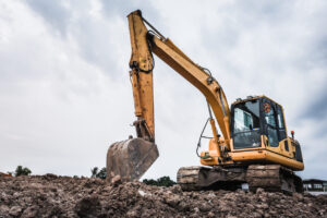 Yellow excavator on construction site