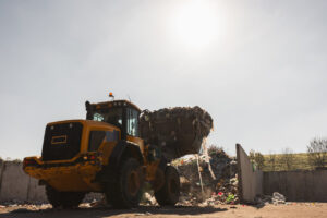 Compact Track Loaders vs Skid Steers for Contractors 3 Yellow skid steer lifting debris
