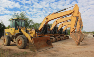 Row of yellow construction machinery.