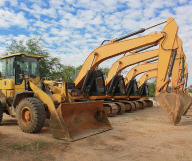 Row of yellow construction machinery.