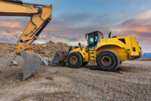 Yellow excavator on construction site