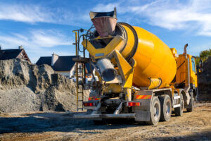 Yellow cement truck at construction site