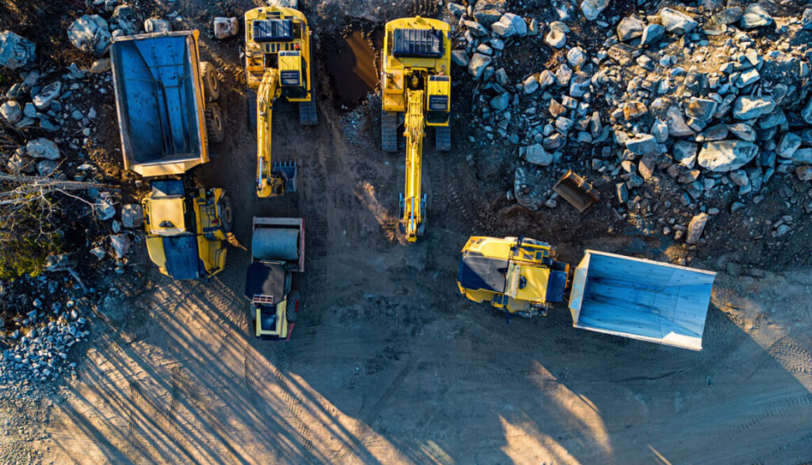 Various yellow construction vehicles on site