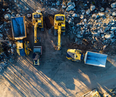 Various yellow construction vehicles on site