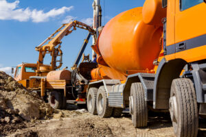 Construction vehicles at a worksite Pump Trucks and Mixer Pump Combos