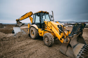 Yellow backhoe on construction site