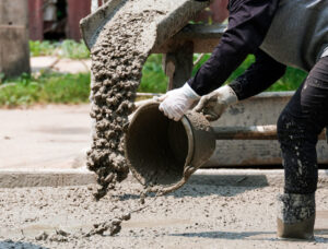 Top 22 Construction Equipment Types for Contractors 14 Pouring concrete from a bucket