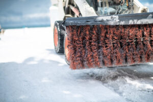 Top 5 Skid Steer Attachments for Contractors in 2026 6 Skid steer with large broom attachment