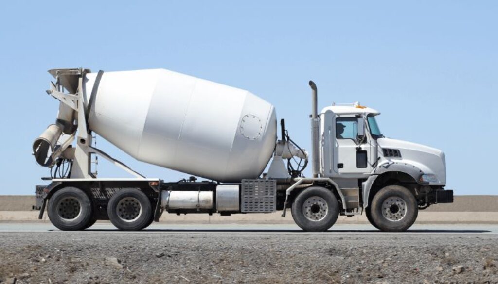 White concrete truck mixer truck on road