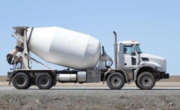 White concrete truck mixer truck on road